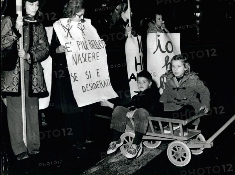 Jan. 01, 1975 - During a manifestation to introduce the abortion in Italy, a woman carried her sons bringing a poster: ''It is better born if we are wished'