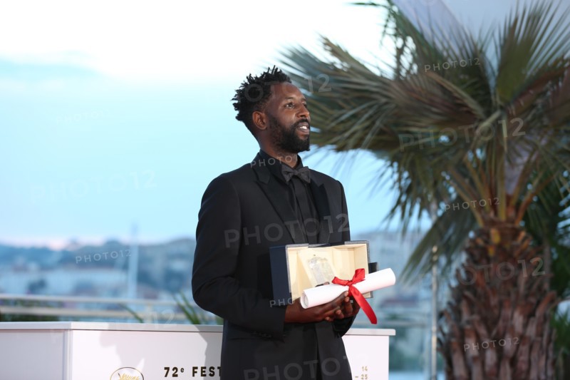 CANNES, FRANCE - MAY 25: Director Ladj Ly, winner of the Jury Price award for his film "Les Miserables" poses at the photocall for Palme D'Or Winner d