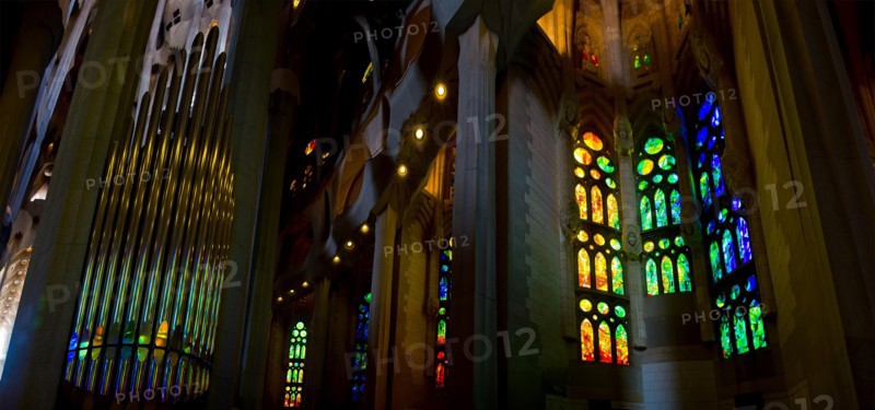 stained glass windows and organ pipes in the Sagrada Familia in Barcelona