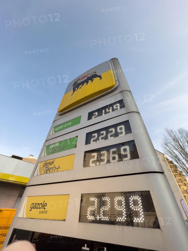 Strasbourg, France - Mar 11 2022: View from below of Italian Eni gas station with new prices at the pump exceeding all expectations. The war in Ukraine has pushed fuel prices above the two-euro threshold for first time.