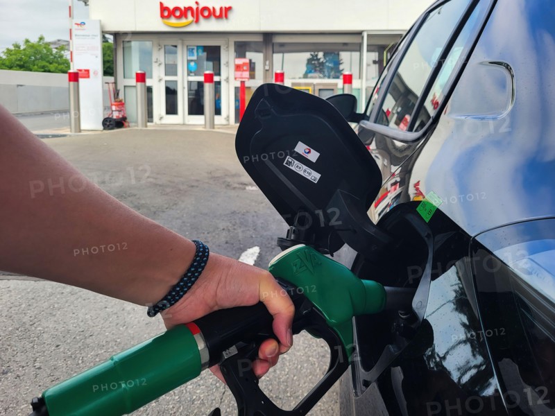 PARIS, FRANCE - JUNE 2022: Refueling a car with E10 super at a french gas station