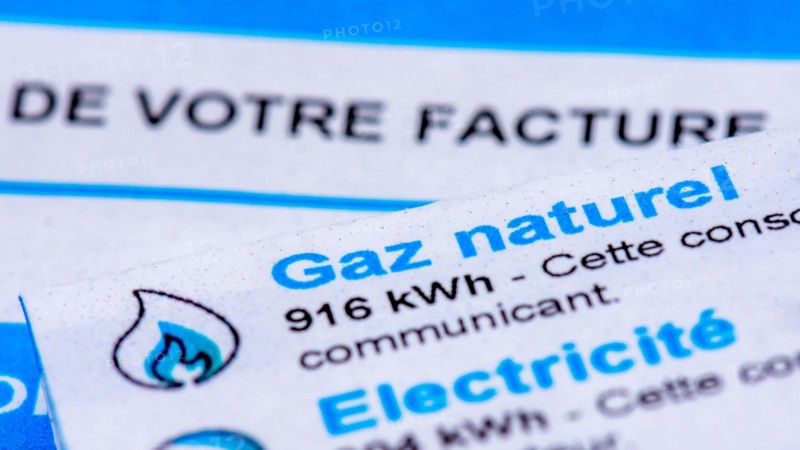 Rise of energy prices in France: close-up of a French invoice with details of the natural gas and electricity consumptions to be paid measured in kWh