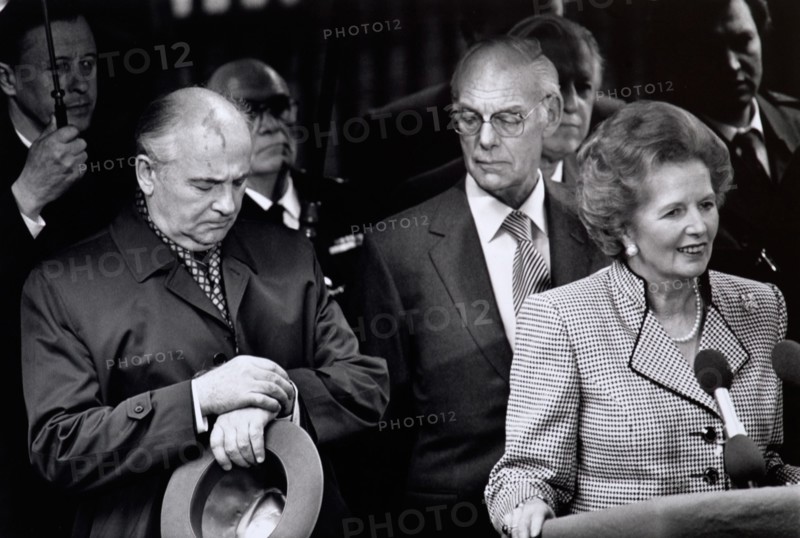 Mikhail Gorbachev checks Kremlin time during his 1989 visit to London.