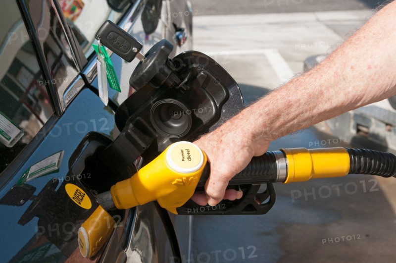 Filling the diesel fuel tank of a Citroen car at a service station