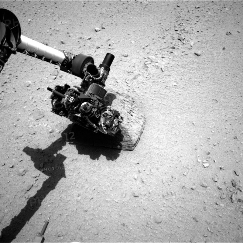 This image shows the robotic arm of NASA's Mars rover Curiosity with the first rock touched by an instrument on the arm. The rover's right Navigation Camera (Navcam) took this image during the 46th Martian day, or sol, of the mission (Sept. 22, 2012). On that sol, the rover placed the Alpha Particle X-Ray Spectrometer (APXS) instrument onto the rock to assess what chemical elements were present in the rock. The rock is named "Jake Matijevic" in commemoration of influential Mars-rover engineer Jacob Matijevic (1947-2012).

JPL manages the Mars Science Laboratory/Curiosity for NASA's Science Mission Directorate in Washington. The rover was designed, developed and assembled at JPL, a division of the California Institute of Technology in Pasadena.