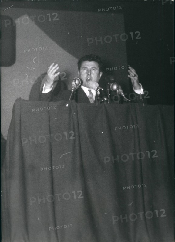 Jan. 01, 1956 - Poujade calls up partisans for mass meeting Pierre Poujade, leader of the new traders and Artisans party, held a mass meeting at the palais Des sports Paris, today. photo shows Poujade addressing his followers.