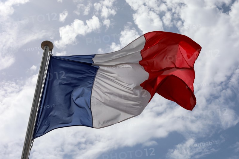 Tricolour flag against sky on the National Day of France in Nice, France