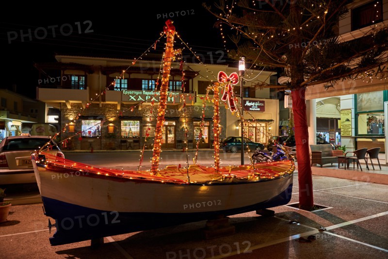 Wooden Christmas ship decorated at night. In the Greek tradition (especially in the islands) it is common to ornament a ship instead of a tree for Ch