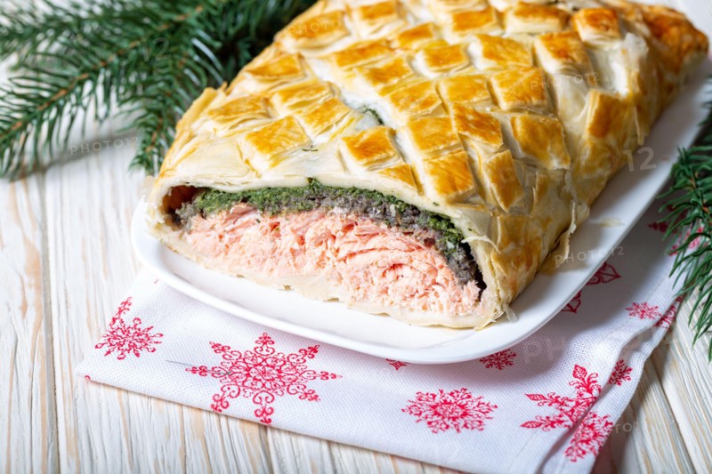 Homemade Salmon Wellington. It is made from Salmon Fish, spinach, mushrooms, spices, herbs and puff pastry. Copy space