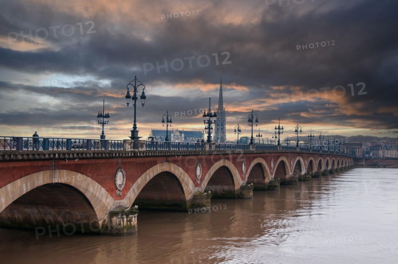 The stone bridge in Bordeaux, in the rain, in Gironde, New Aquitaine in France