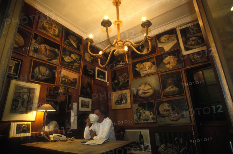 Mr Poilane drinking coffee in his office paris