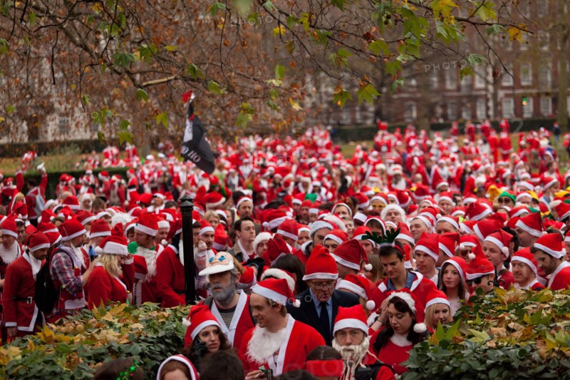 London, UK. 14th of December 2013 Annual Santa Con gathering hits Central London. Every year in December thousands of people dress up as Santa for the annual get together of Santa Con, they walk from various landmarks in London. Credit:  nelson pereira/Alamy Live News