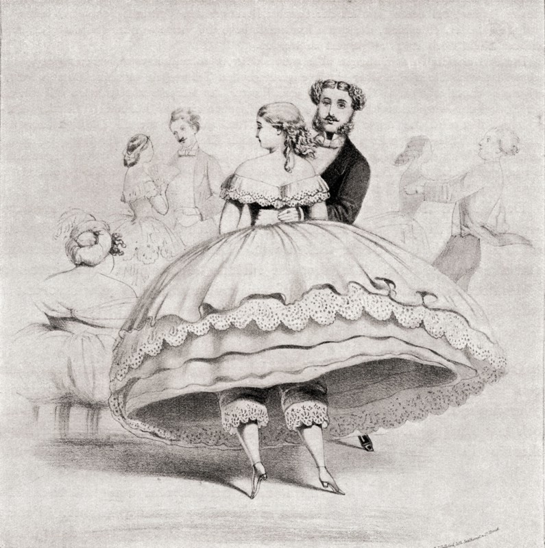 19th century lady wearing a crinoline at a ball.