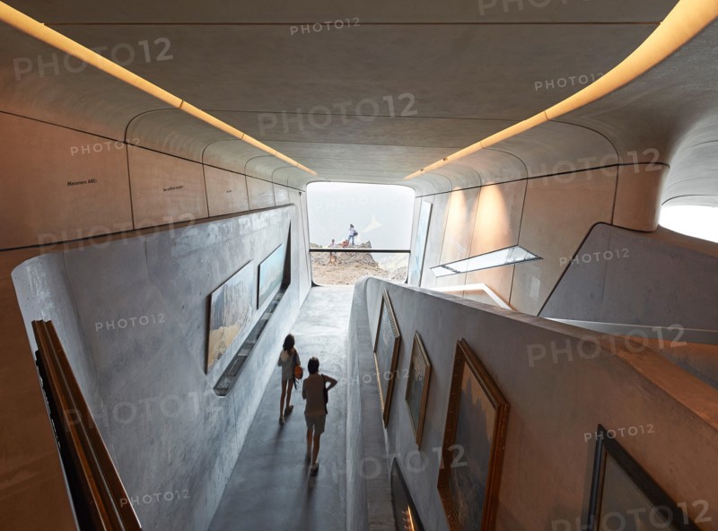 Curved exhibition room with picture window. Messner Mountain Museum Corones, Mount Kronplatz, Italy. Architect: Zaha Hadid Archi