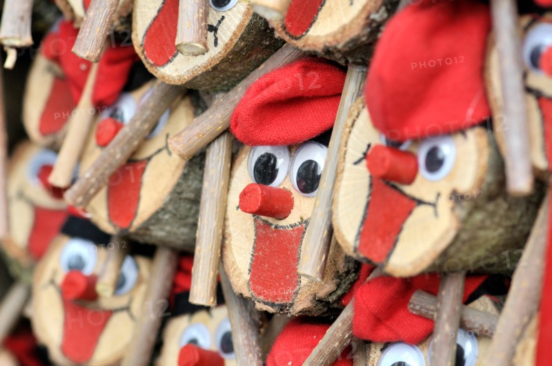 Tions de Nadal (Christmas logs), Catalan tradition, for sale at fair. Fira de Santa Llúcia, Barcelona, Catalonia, Spain