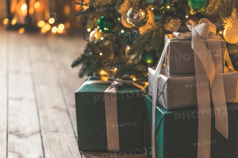 Christmas tree with gifts in Christmas living room. Beautiful New Year decorated classic home interior. Winter background