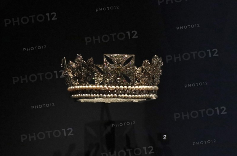 An exhibition exploring the life of George IV reunites for the first time items that were commissioned and worn by the king at his famously flamboyant coronation at Westminster Abbey , London ,in 1821 . Marking the 200 th anniversary in 2020 of the Monarch's ascent to the throne .The coronation was the most spectacular moment of george's life and came at a cost of more than -ú240.000 . the King himself oversaw the design of his coronation robes , including the crimson velvet surcoat and a stole made from cloth of silver , gold thread and silk embroided with the national flowers of the UK .