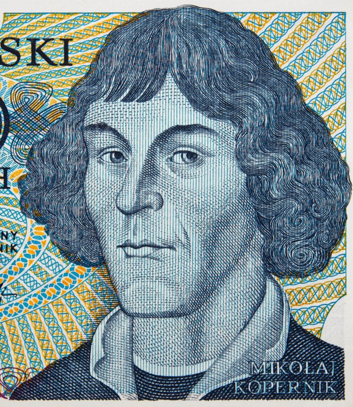 Nicolaus Copernicus face portrait on Poland zloty banknote closeup. Genius renaissance mathematician and astronomer.