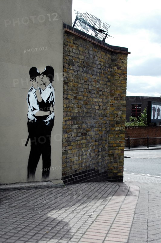 Banksy Kissing Policemen with empty pavement (now removed)