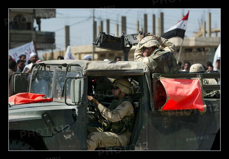 Iraq War April 2003 American soldiers massacre for the second time in 3 days in the town of Al Fallujah approx 50 kilometers north west of Baghdad American soldiers opened fire in descriminately on a demonstration against their massacre on Monday night at the school While the demo was outside the Americans base soldiers sprayed the crowd with bullets killing it is believed at least two people and injuring many more Protestors duck for cover