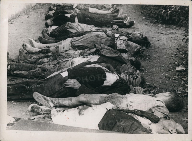 Nov. 11, 1937 - Bodies laid out for burial after Insurgent planes had bombed a school in Barcelona during Spanish civil war. Cr