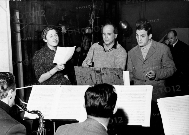 Poet Leo Ferre conducts for a film