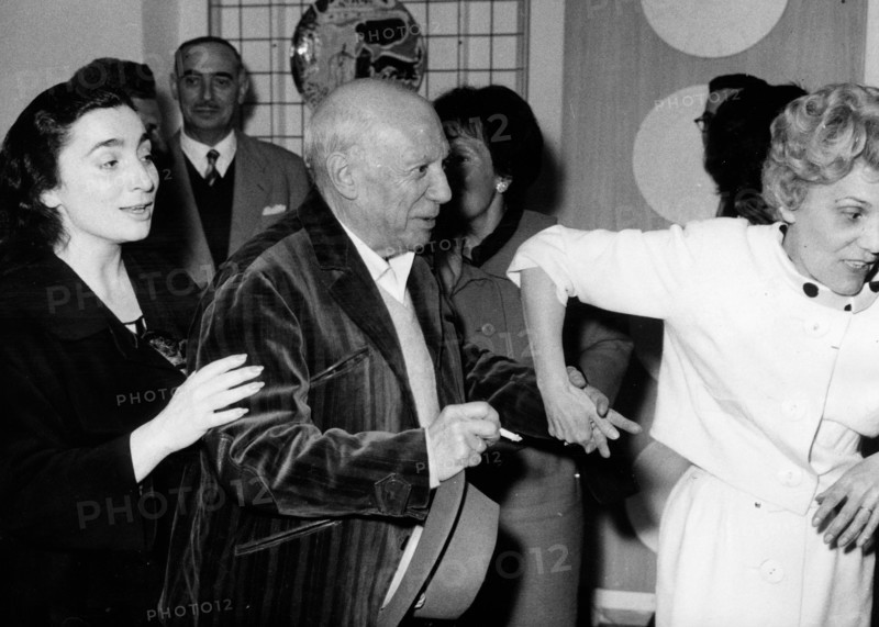 Artist Pablo Picasso with Mademoiselle Ramier and his wife Jacqueline Roque at his gallery exhibition