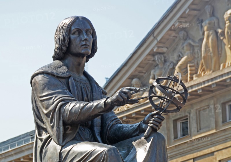the Polish astronomer Nicolaus Copernicus, holds a compass and armillary sphere,  Warsaw, Poland.