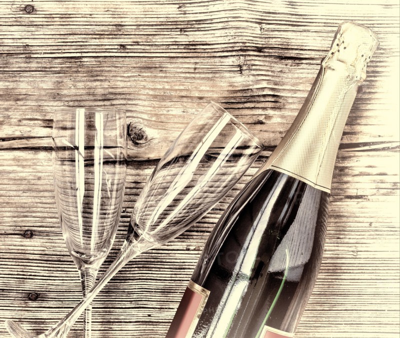 Champagne. Champagne bottle and two empty glasses on a wooden background. Valentine's Day. Birthday. Wedding. Anniversary. Rustic style.