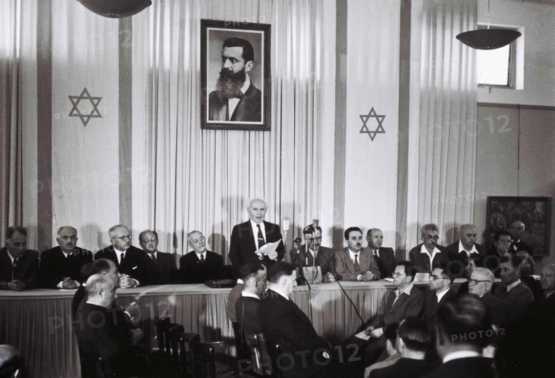 David Ben Gurion, who was to become Israel's first Prime Minister, reads the Israeli Declaration of Independence May 14, 1948 at the museum in Tel Aviv, during the ceremony founding the State of Israel.