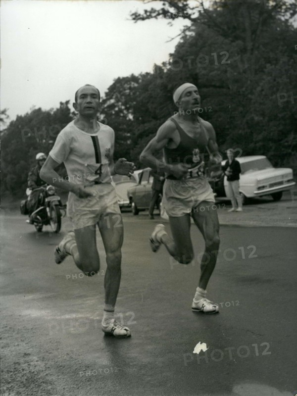 Jun. 26, 1966 - Alain Mimoun, who won the Paris's 10,000 meter race a week ago, surprised us again by winning the Marathon in front of Combes at the age of 46. Combes and Mimoun are pictured running the course here.