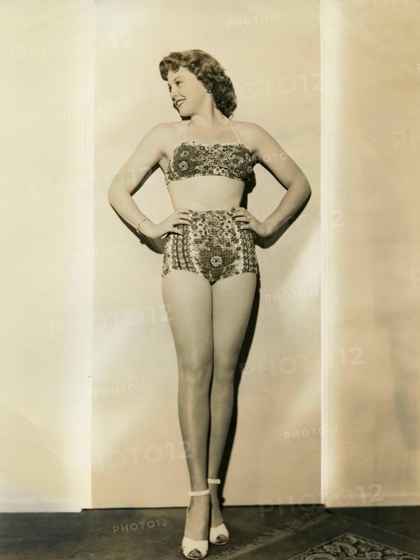 The American actress Suzi Crandall wears a two-piece swimsuit 40s