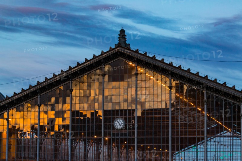 A reflection of sunset on the lattice window of the Nyugati Railway Station in Budapest