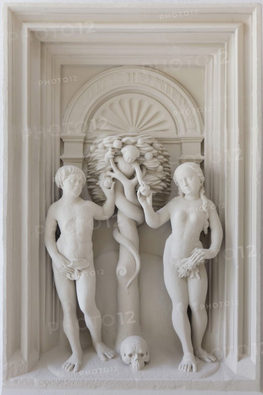 Adam and Eve. Plaster cast of the relief from the Renaissance altarpiece by German sculptor Johann Brabender (1546) from the Hildesheimer Domlettner on display in the Cathedral Museum (Dom Museum) in Hildesheim in Lower Saxony, Germany.