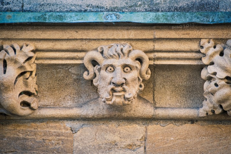 Carved stone horned gargoyle / grotesque on Merton college. Oxford, Oxfordshire, England