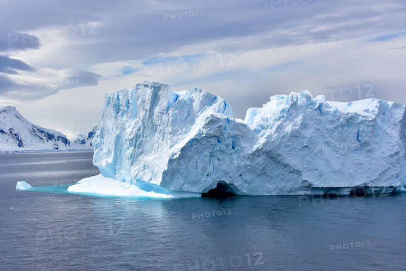 A beautiful blue iceberg floating in Antarctica.