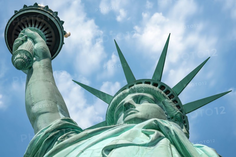 The Statue of Liberty standing on Liberty Island in the middle of New York Harbor, Manhattan, New York - USA.