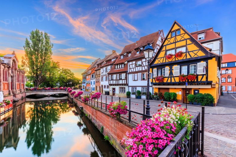 Colmar, Alsace, France. Petite Venice, water canal and traditional half timbered houses.
