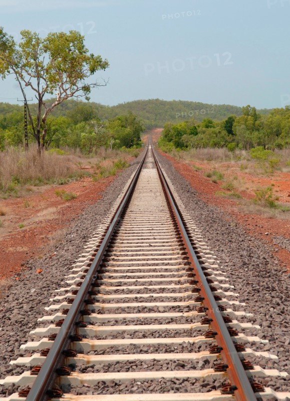Straight railway track on the Alice Springs to Katherine Rail line carrying The Ghan,