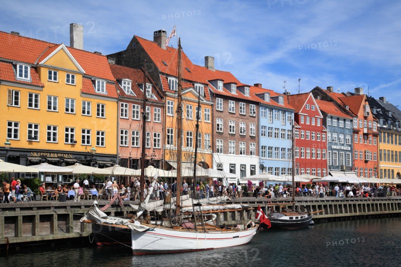 Tourists and colourful houses at Nyhavn, Copenhagen, Denmark