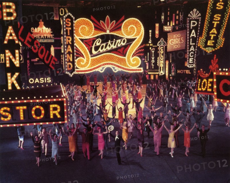SINGIN'  IN THE RAIN 1952 MGM musical film with Gene Kelly holding straw hat