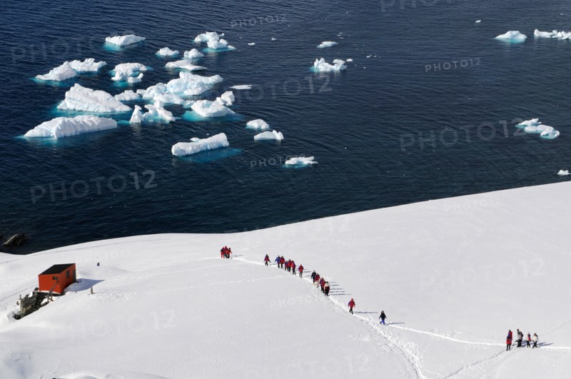 Tourists at Antarctic base Almirante Brown in Paradise Bay, Antarctic Peninsula, Antarctica