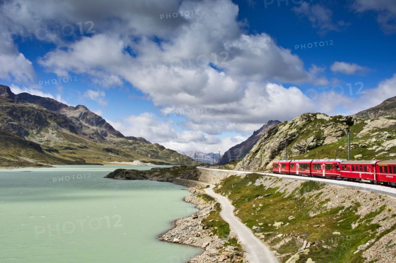 The Glacier Express train winds its way around the rocky mountain lakes of Switzerland