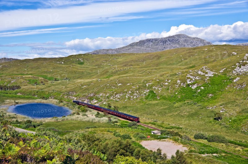 The afternoon Jacobite steam train heading towards Mallaig from Morar in the west highlands of Scotland