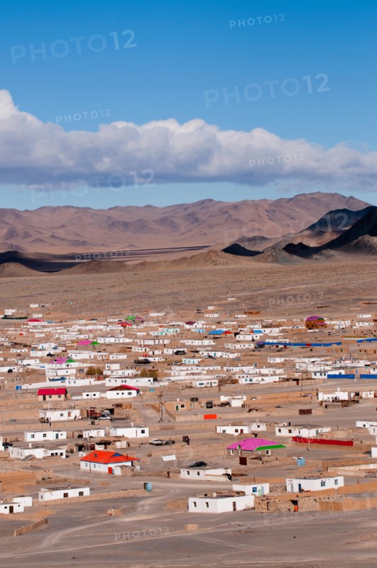 Outer suburbs of Olgii with some new houses among traditional homes.