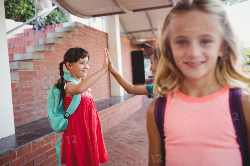 Three happy kids at school