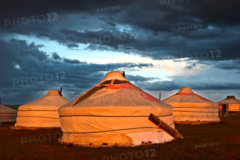 Gers or yurts of the Khatan Ugii Tourist Camp at sunset at Lake Ogii Nuur, Mongolia