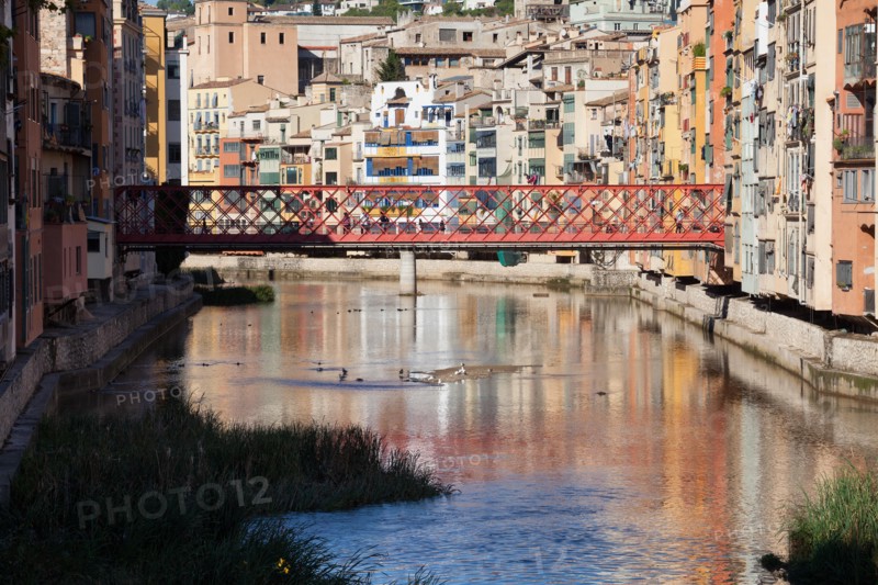 Historic houses and the Eiffel Bridge over the Onyar River in Girona, Catalonia, Spain