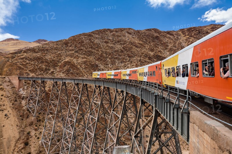 Train to the clouds (tren a las nubes) crossing La Polvorilla bridge in the Altiplano 4.200 meters/13800 feet high, Salta Province, Argentina