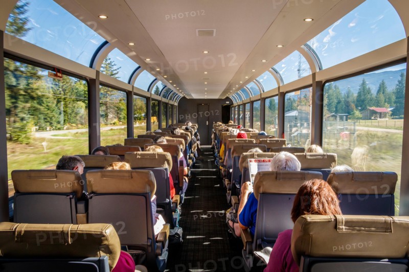 Inside the carriage of the Rocky Mountaineer railway train as it rolls through the countryside of British Columbia, Canada.